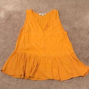 Golden yellow sleeveless peplum top